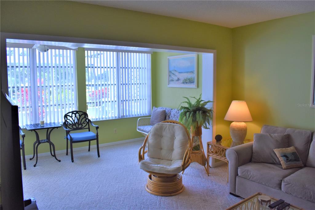 448 Cerromar Road, Unit 189 Venice, FL 34293 - Photo 34 of 48 a living room with furniture and a large window