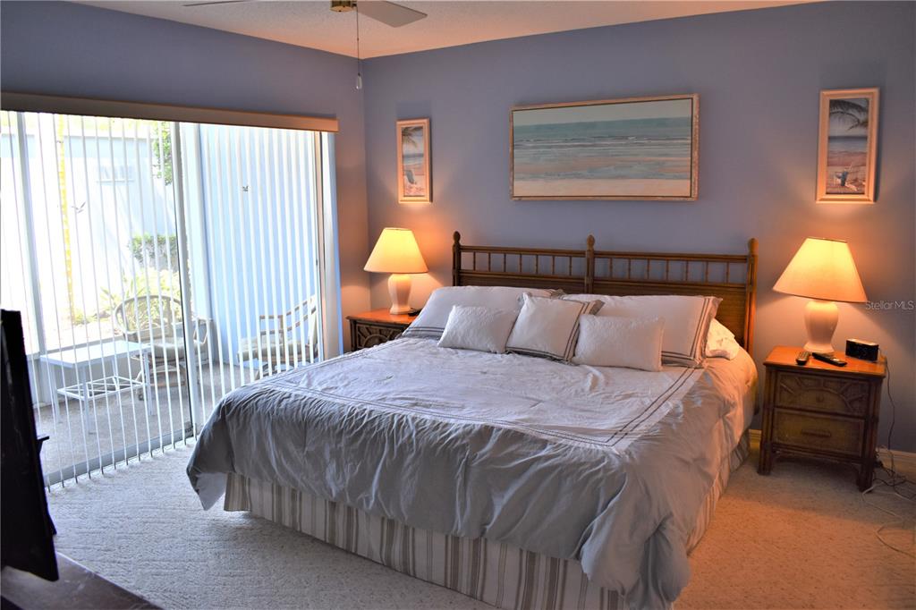 448 Cerromar Road, Unit 189 Venice, FL 34293 - Photo 39 of 48 a bedroom with a bed and lamp