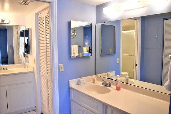 a living room with flat screen tv and a floor to ceiling window