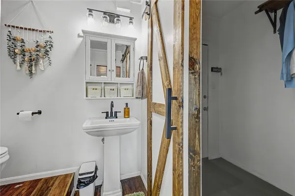 a view of a hallway with washer and dryer
