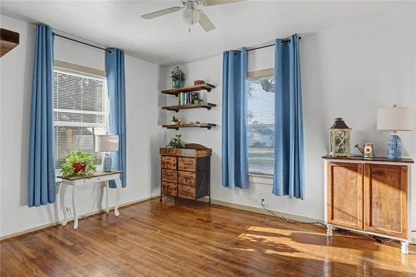 a bathroom with a sink a mirror and a window