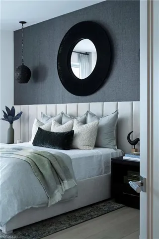 a view of a workspace with furniture and floor to ceiling window