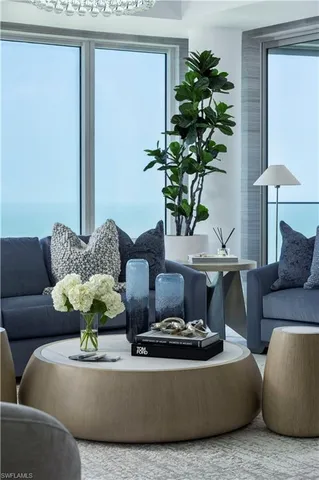 a living room with furniture or couch and a large window