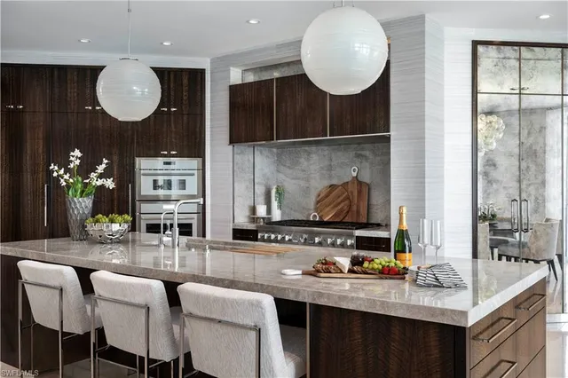 a view of a dining room with furniture and chandelier