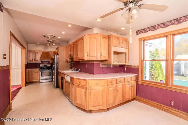 a kitchen with a stove and a refrigerator