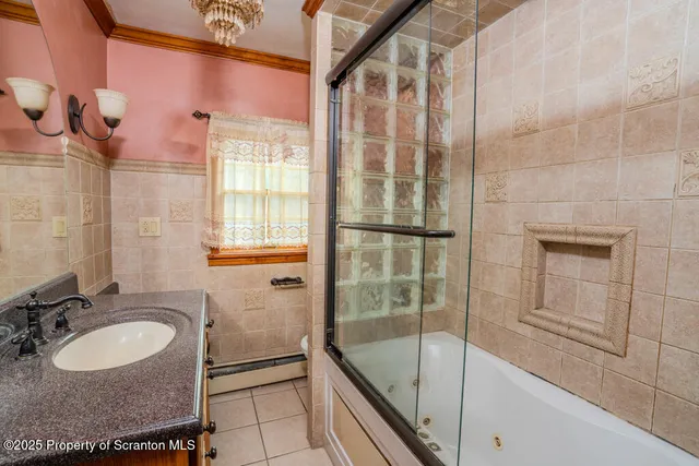 a room with pool table and windows