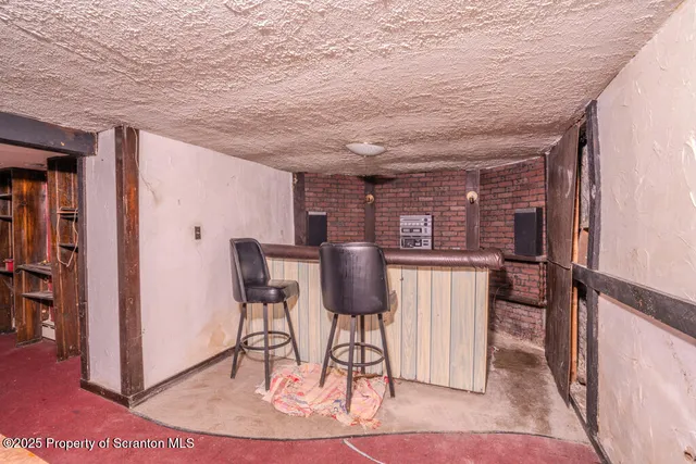 a view of a hallway to a bedroom