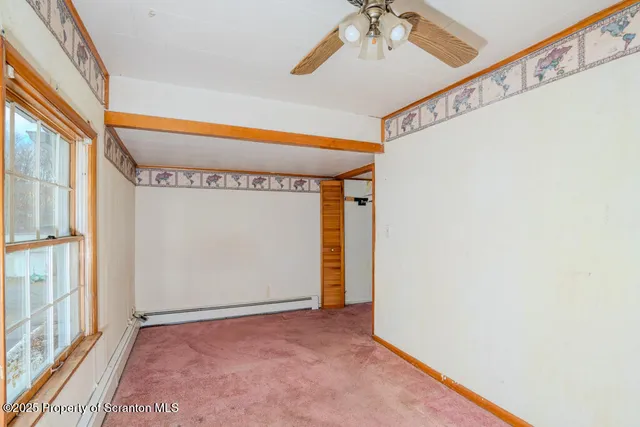 a view of a room with table and a chandelier