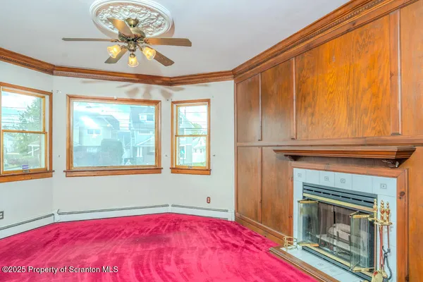 a view of a bedroom with a bed and a chandelier