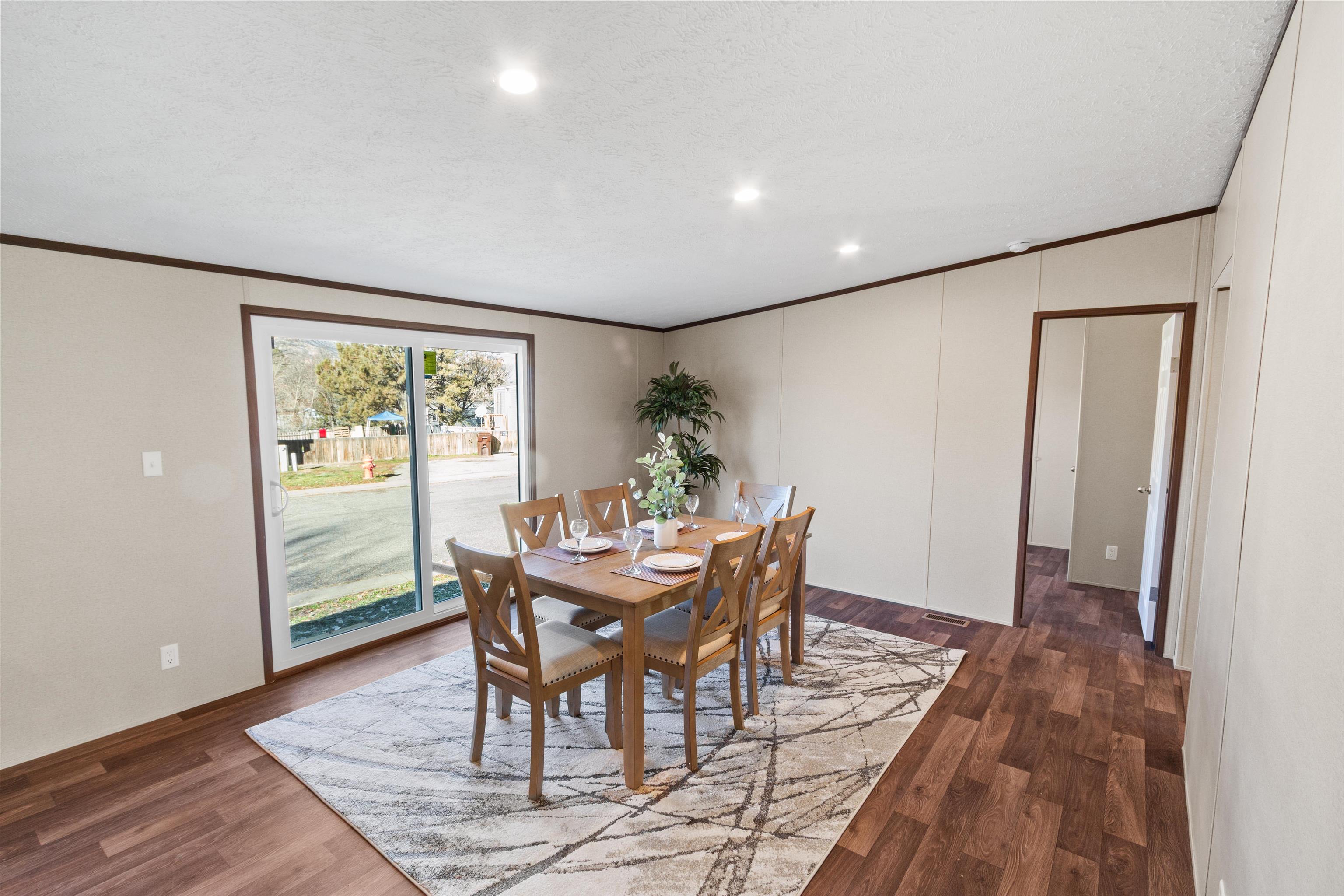 133 West Carson Circle Parachute, CO 81635 - Photo 14 of 25 a dining room with furniture and wooden floor