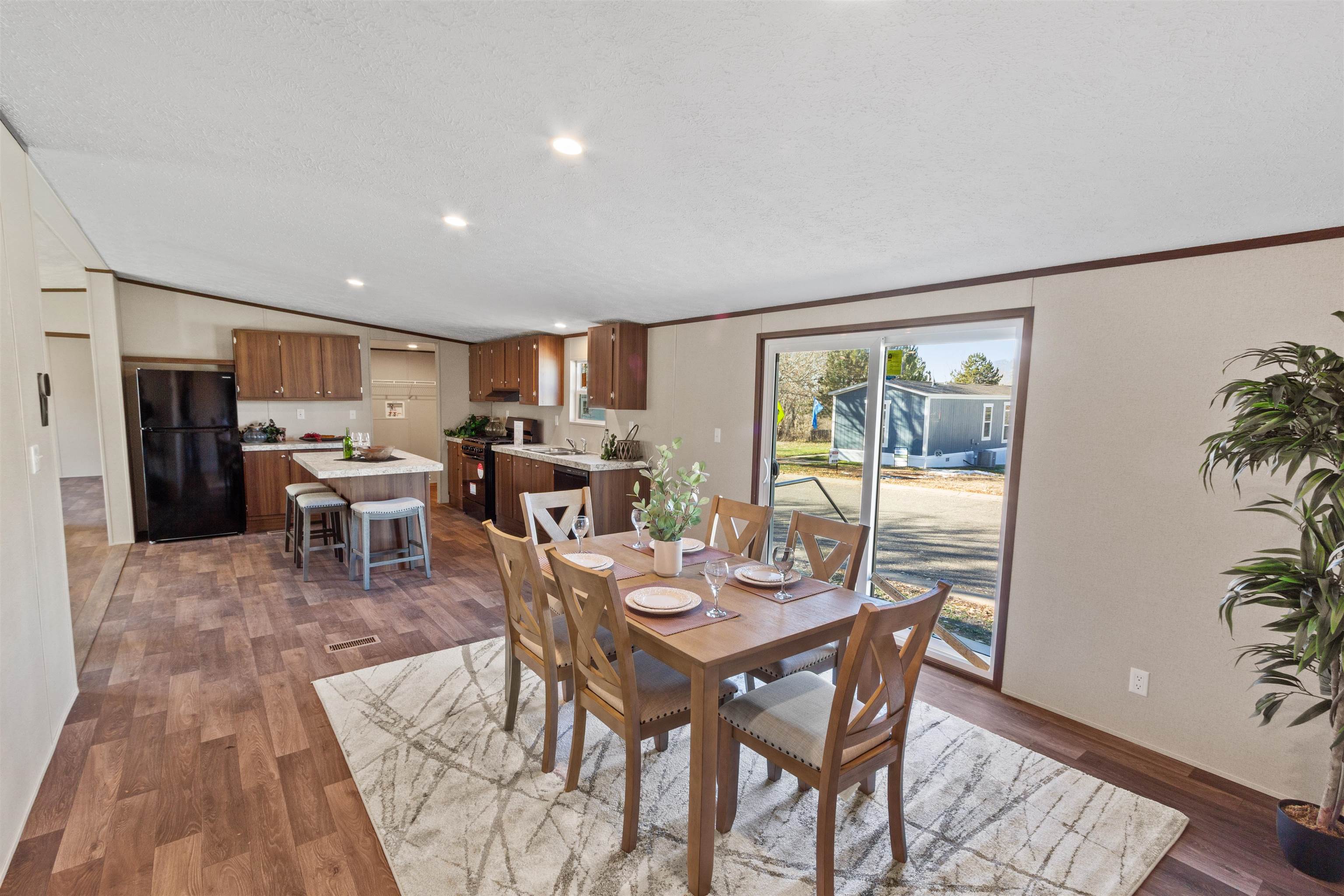 133 West Carson Circle Parachute, CO 81635 - Photo 15 of 25 a view of a dining room with furniture window and wooden floor
