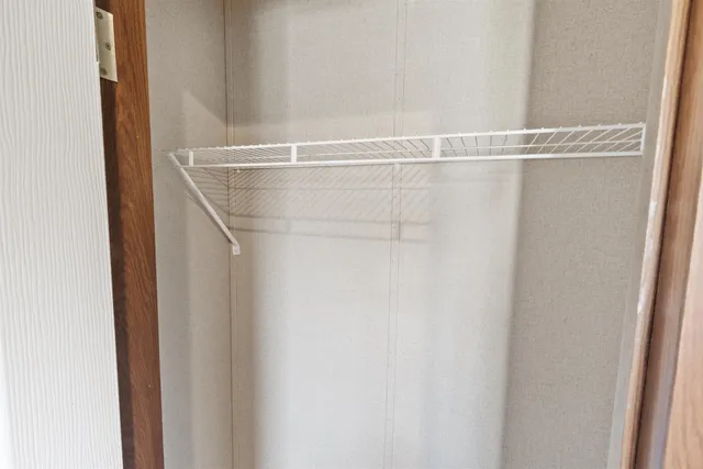 a view of a room with racks on the wall