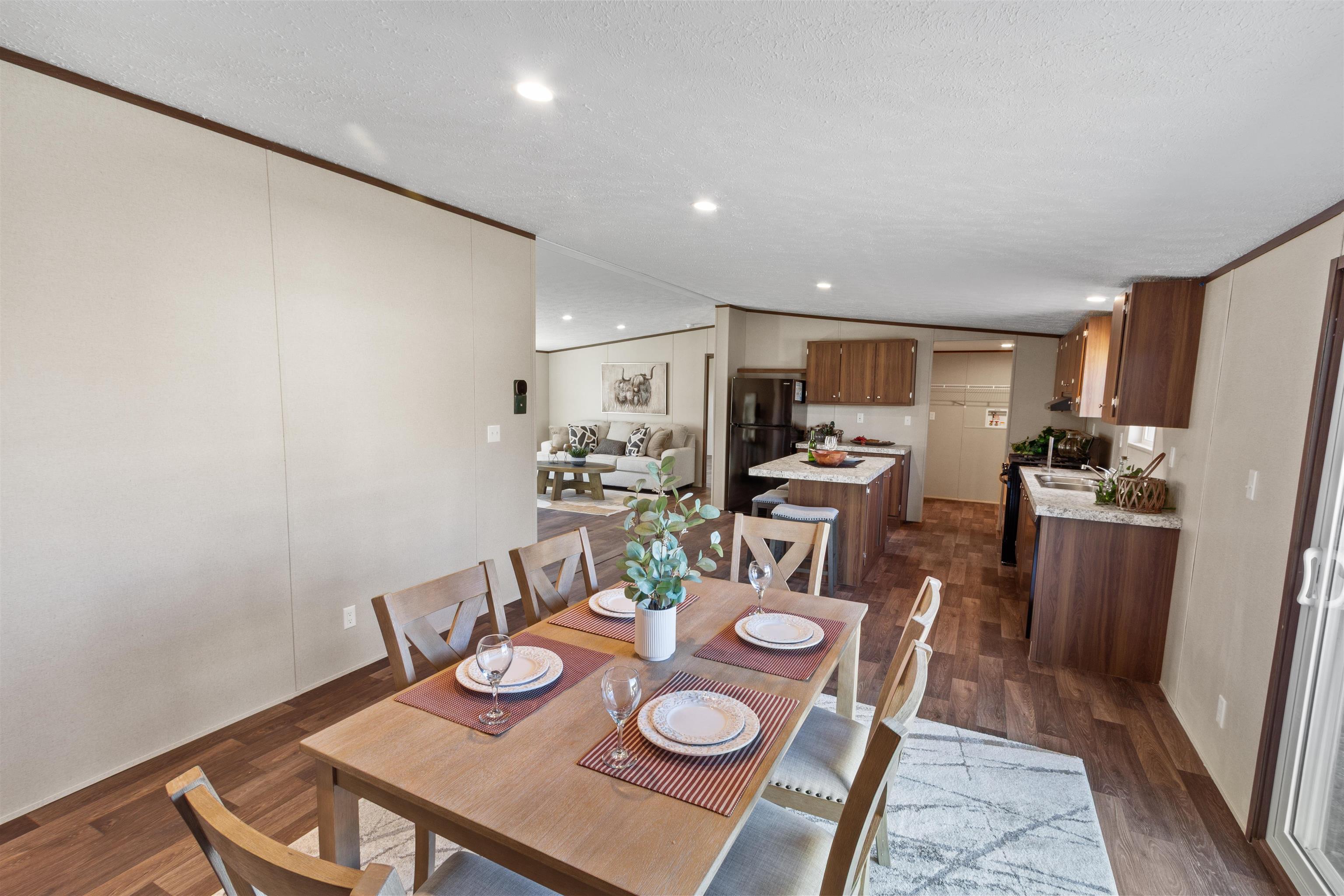 133 West Carson Circle Parachute, CO 81635 - Photo 24 of 25 a view of a dining room with furniture kitchen view and wooden floor