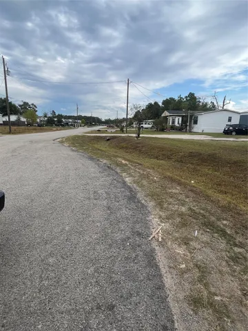 a view of a lake with houses in the back