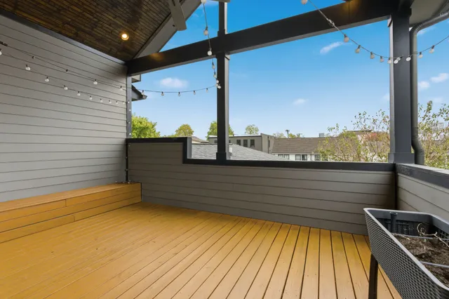 a view of a balcony with two chairs