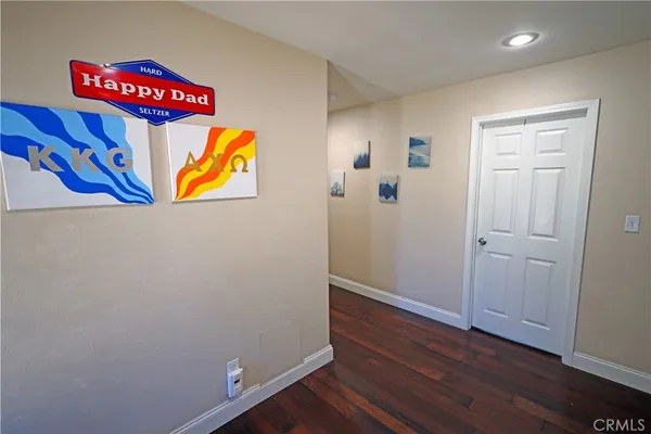 a view of a dining room with furniture and a window