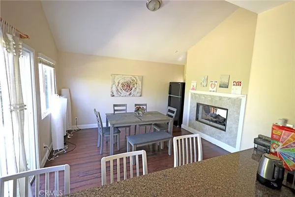 a kitchen with granite countertop a sink and a stove
