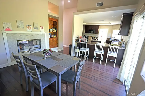 a kitchen with stainless steel appliances granite countertop a refrigerator a stove top oven a sink and dishwasher
