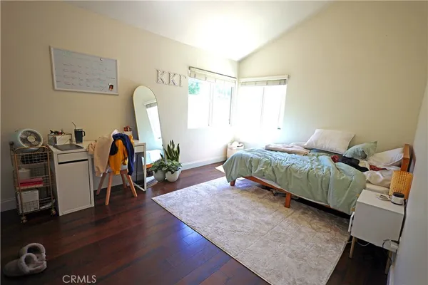 a bathroom with a sink vanity mirror and toilet