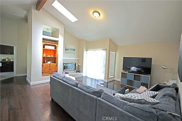 a hallway with furniture and wooden floor