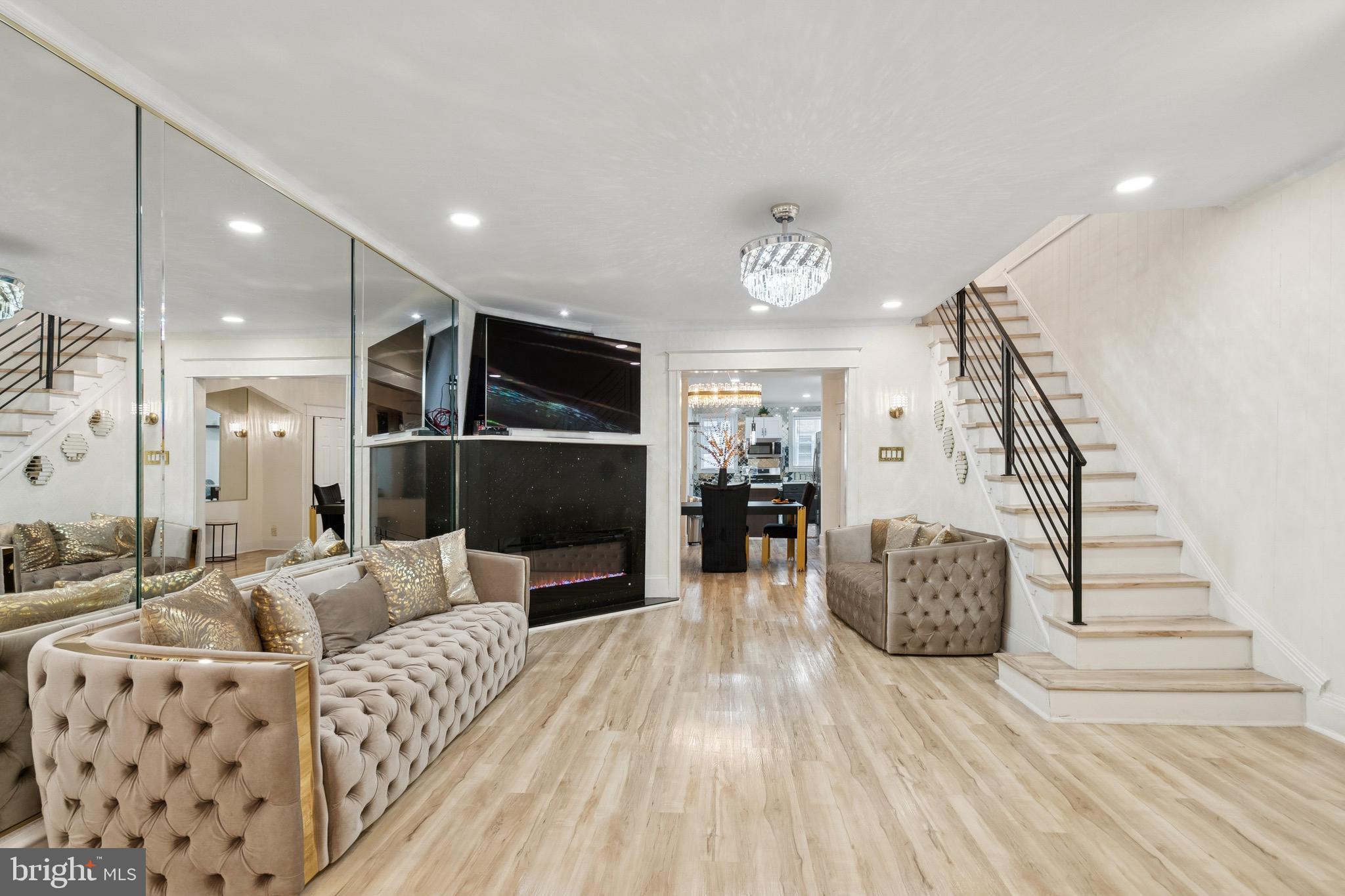 a living room with furniture and a flat screen tv