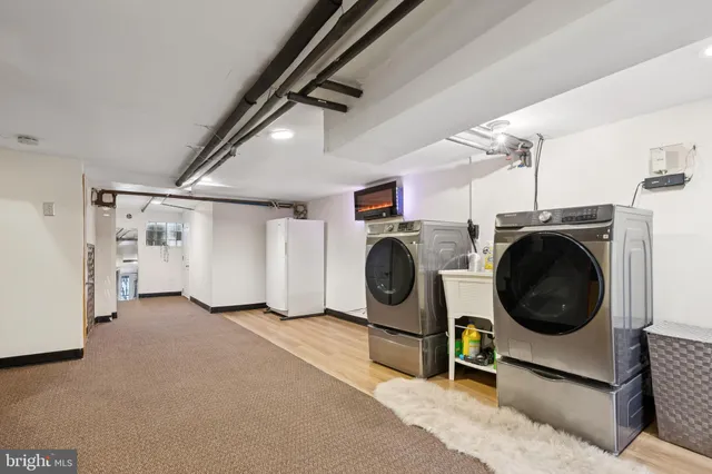 a view of a storage & utility room with washer and dryer