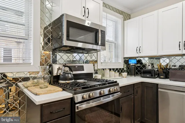 a kitchen with a stove and a microwave