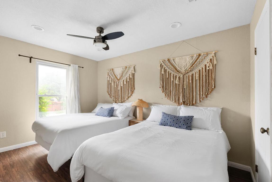 2320 Montclaire Street, Unit A Austin, TX 78704 - Photo 12 of 36 a bedroom with two beds and a window