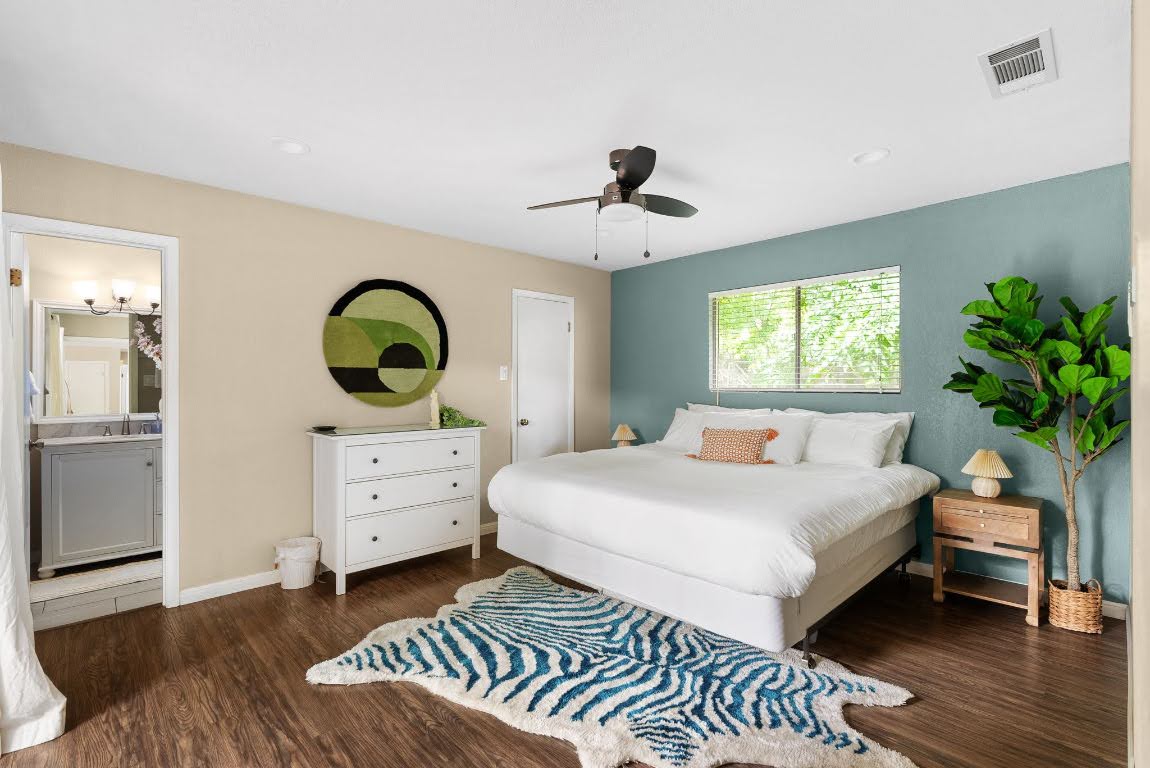 2320 Montclaire Street, Unit A Austin, TX 78704 - Photo 15 of 36 a bedroom with a bed and a dresser