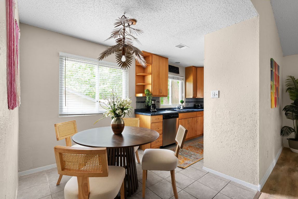 2320 Montclaire Street, Unit A Austin, TX 78704 - Photo 23 of 36 a dining room with furniture and window