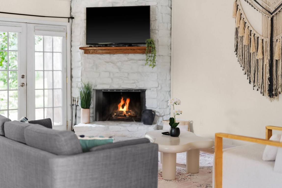 2320 Montclaire Street, Unit A Austin, TX 78704 - Photo 30 of 36 a living room with furniture a flat screen tv and a fireplace