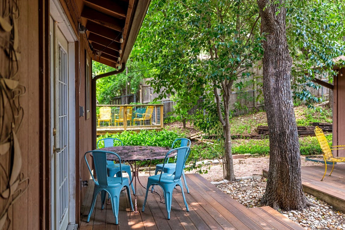 2320 Montclaire Street, Unit A Austin, TX 78704 - Photo 35 of 36 a view of a patio with table and chairs and wooden floor