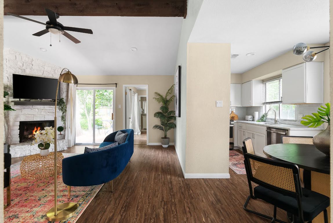 2320 Montclaire Street, Unit A Austin, TX 78704 - Photo 8 of 36 a living room with furniture a fireplace and a flat screen tv