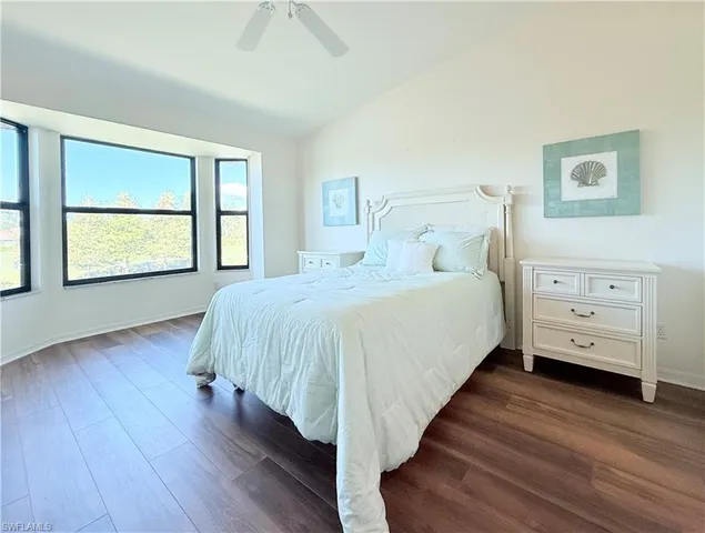 a bed room with a bed and a window