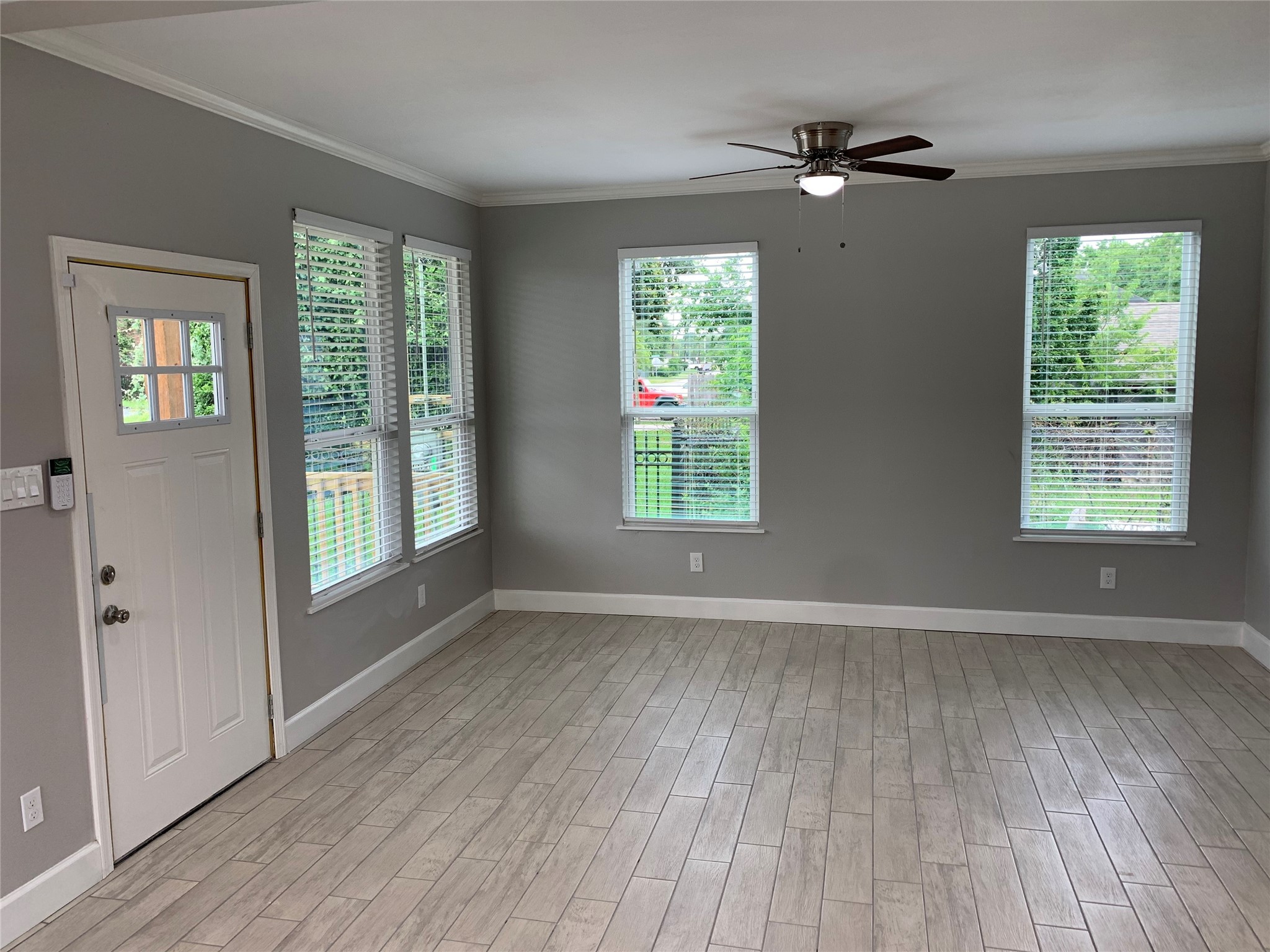 4221 Alvin Street, Unit A Houston, TX 77051 - Photo 2 of 15 wooden floor in an empty room with a window