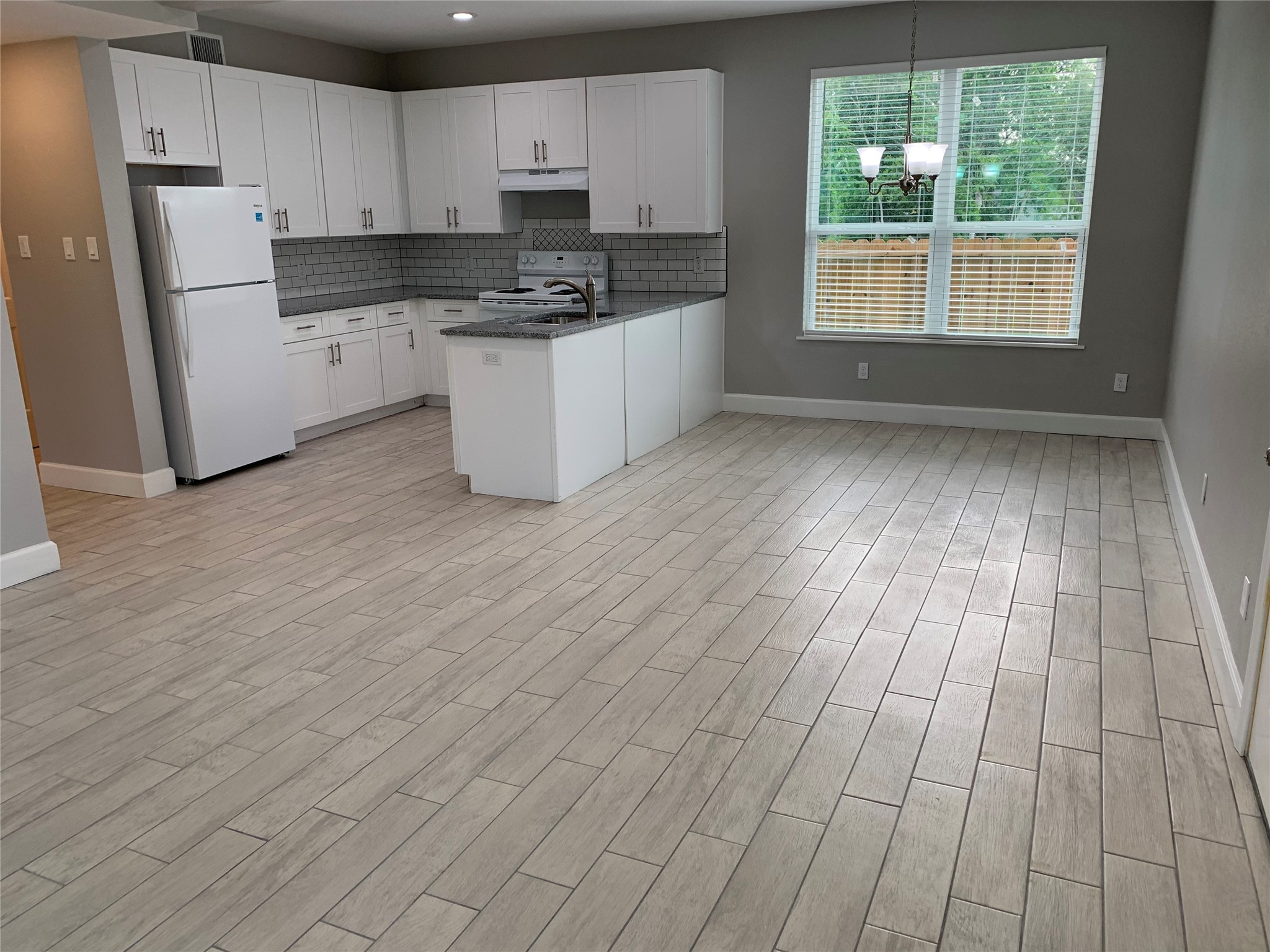 4221 Alvin Street, Unit A Houston, TX 77051 - Photo 4 of 15 a kitchen with cabinets and window