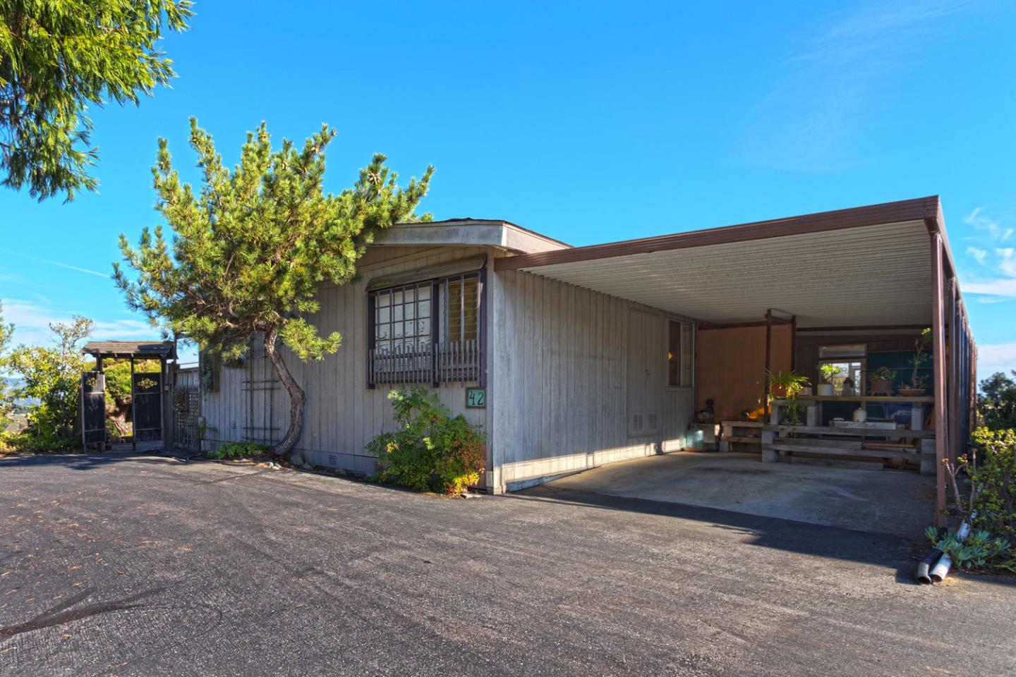 270 Hames Road, Unit 42 Corralitos, CA 95076 - Photo 1 of 25 a front view of a house with a yard