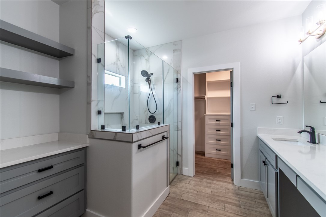 4801 Del Paseo Street Corpus Christi, TX 78411 - Photo 12 of 36 a bathroom with a sink and a mirror
