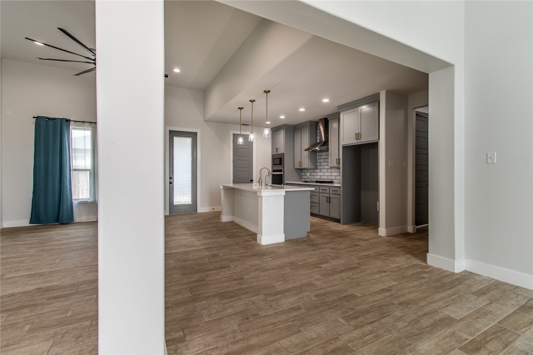 4801 Del Paseo Street Corpus Christi, TX 78411 - Photo 17 of 36 a view of a kitchen with a sink and a refrigerator