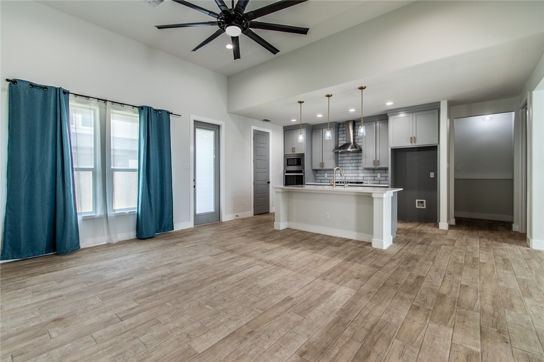 4801 Del Paseo Street Corpus Christi, TX 78411 - Photo 18 of 36 a view of a kitchen with a sink and a refrigerator