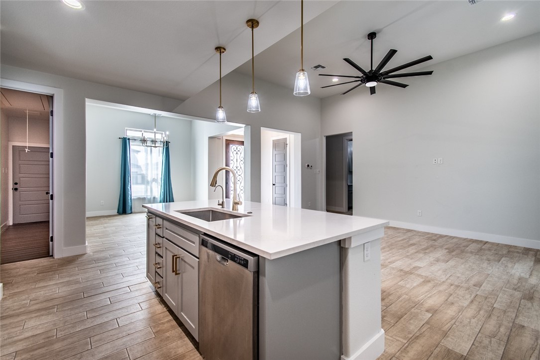 4801 Del Paseo Street Corpus Christi, TX 78411 - Photo 22 of 36 a kitchen with a stove and a wooden floor