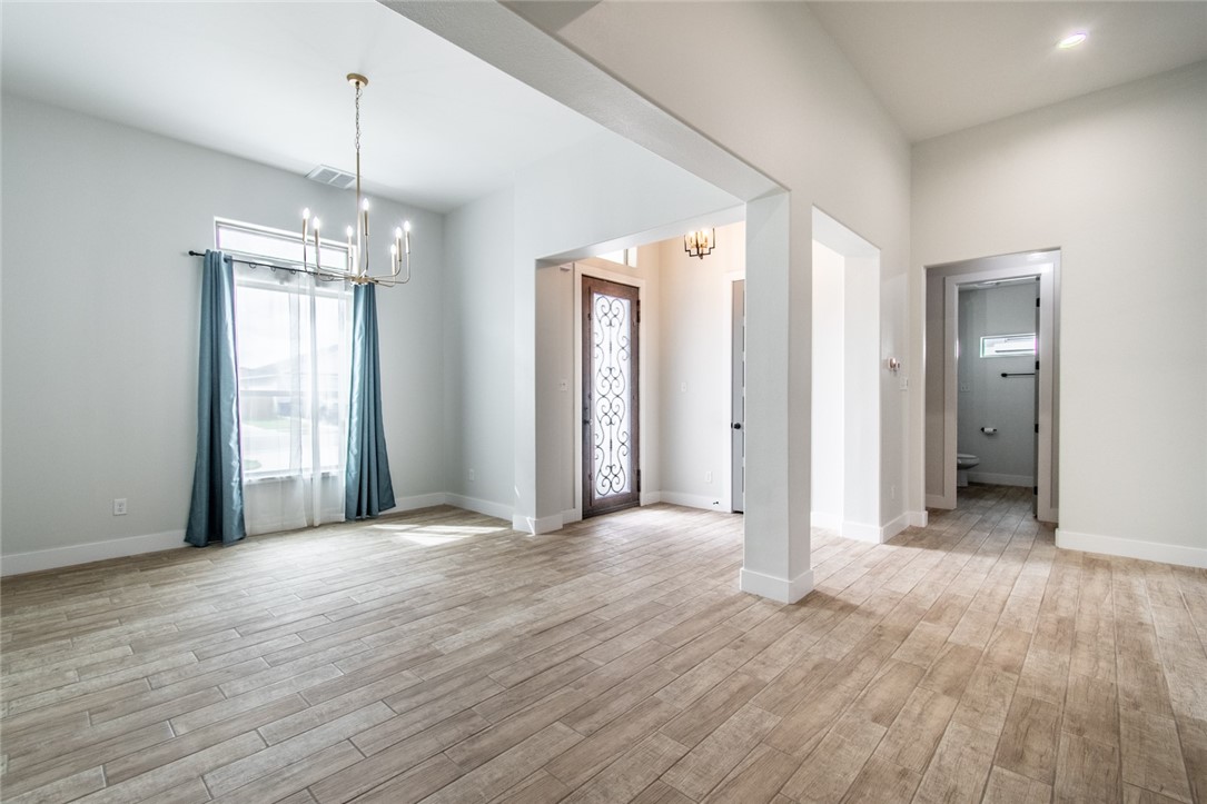 4801 Del Paseo Street Corpus Christi, TX 78411 - Photo 26 of 36 a big room with wooden floor and windows