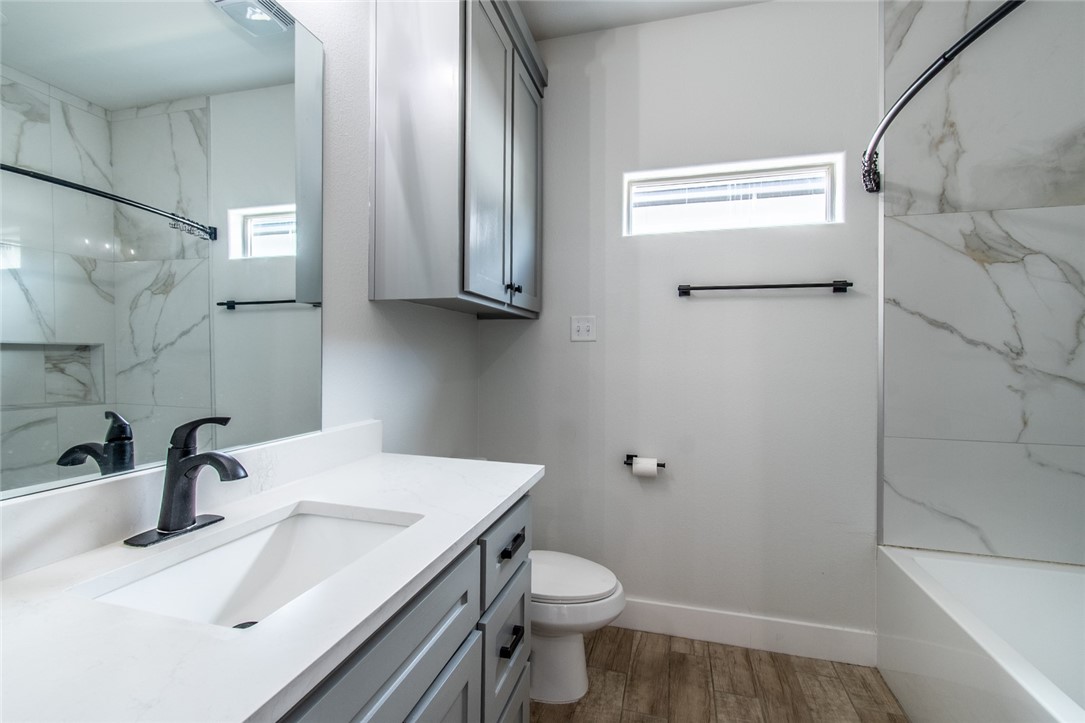 4801 Del Paseo Street Corpus Christi, TX 78411 - Photo 33 of 36 a bathroom with a sink a toilet and shower