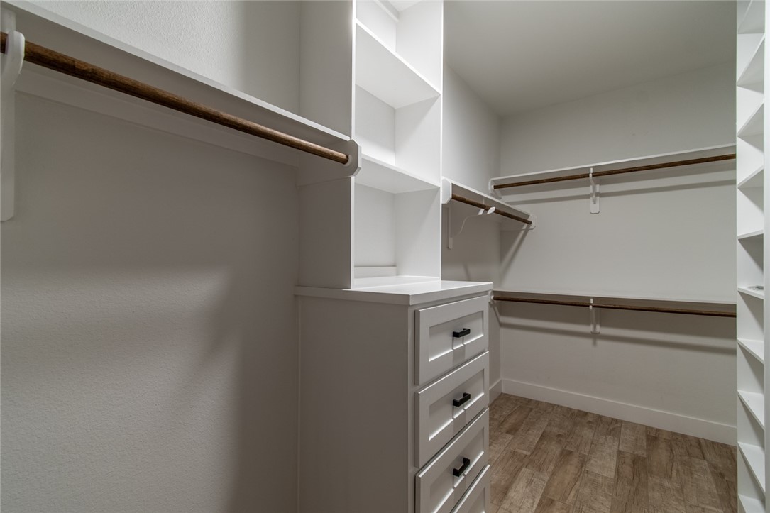 4801 Del Paseo Street Corpus Christi, TX 78411 - Photo 7 of 36 a view of walk in closet with empty racks
