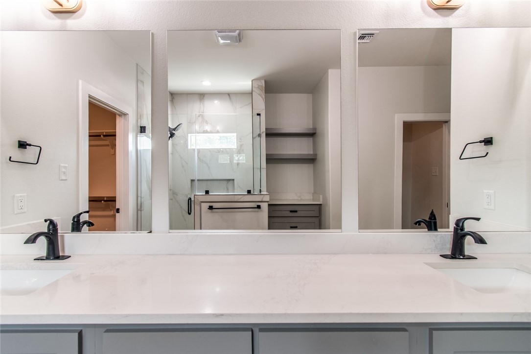 4801 Del Paseo Street Corpus Christi, TX 78411 - Photo 9 of 36 a bathroom with a sink and a mirror