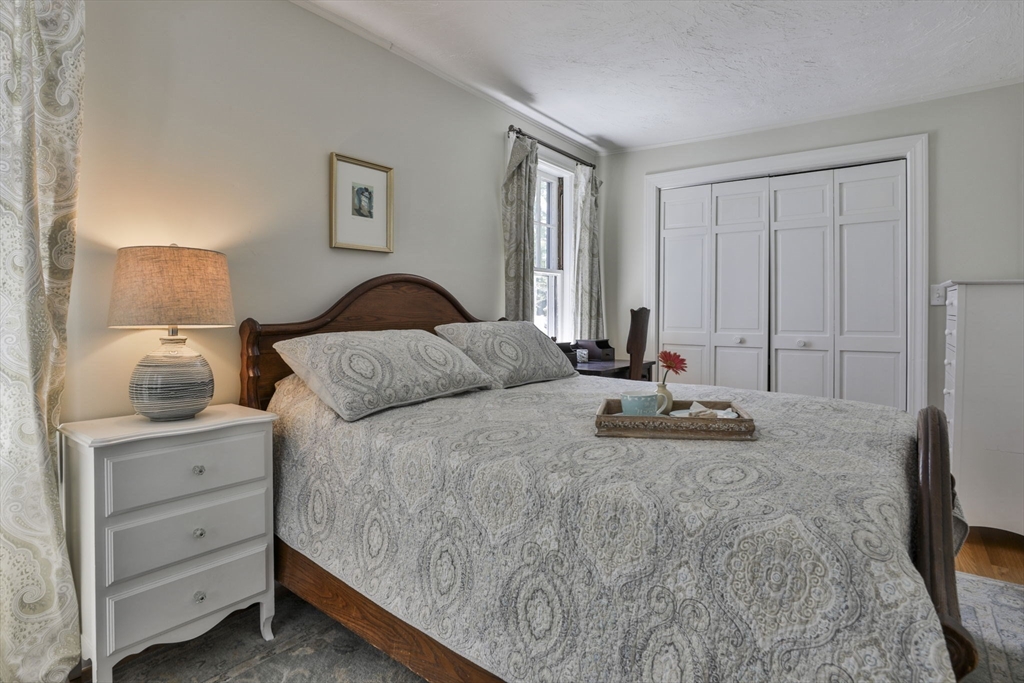 30 Governors Road Milton, MA 02186 - Photo 13 of 31 a bedroom with a bed and a dresser