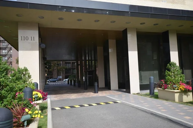 a couple of potted plants in front of door