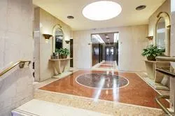 a bathroom with a tub sink and mirror