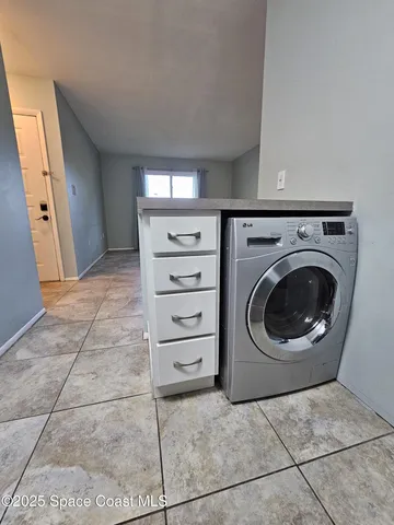 a utility room with dryer and washer