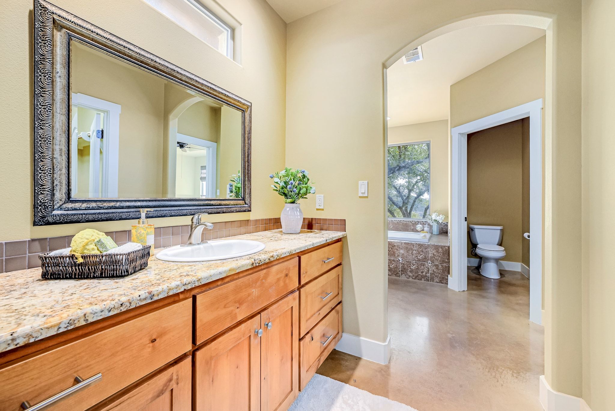 2551 Wolf Creek Ranch Road Burnet, TX 78611 - Photo 18 of 40 Full bathroom with vanity, a bath, and concrete flooring